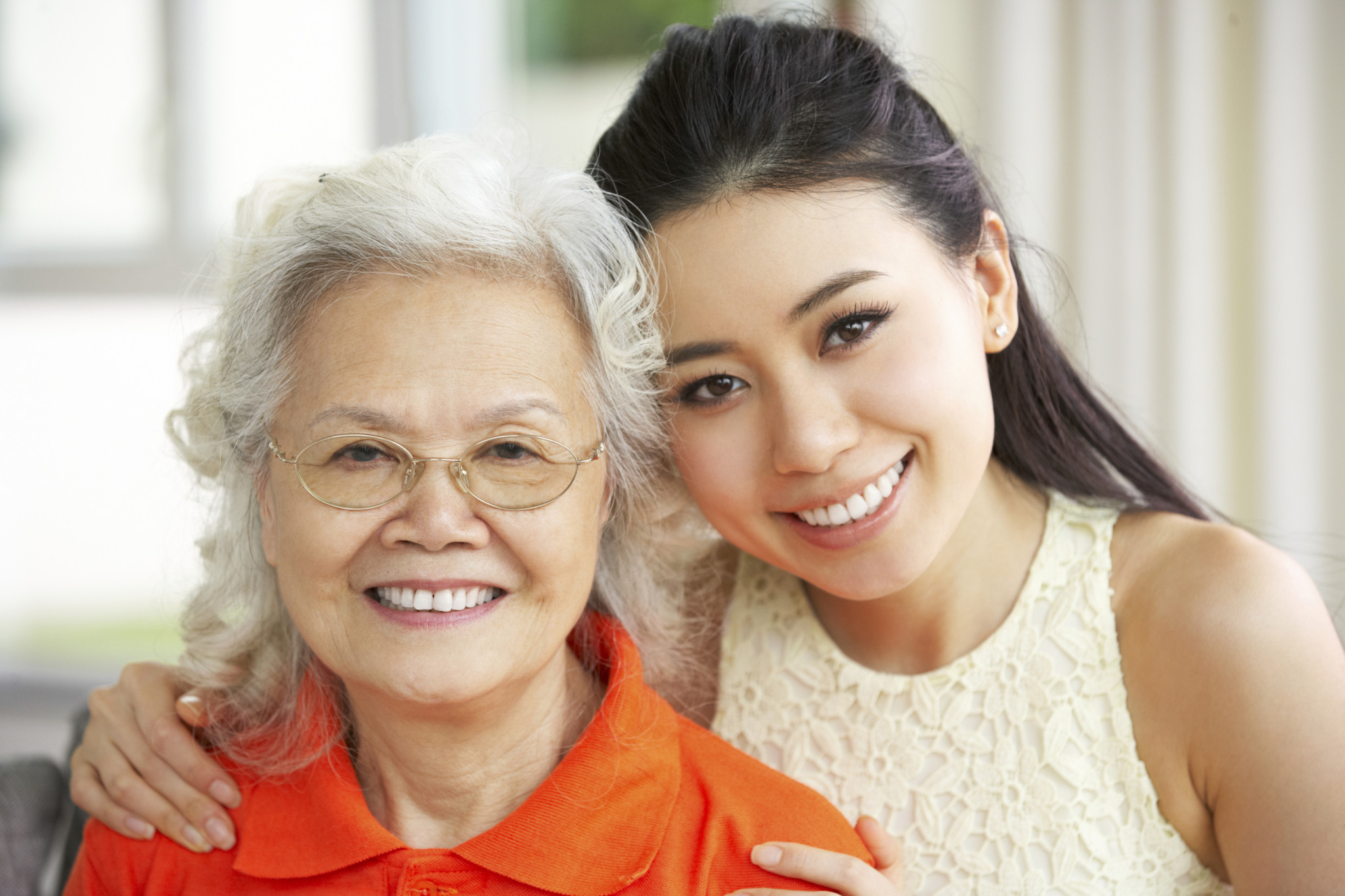 157657779 older-woman-and-younger-woman-smiling
