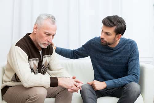 young man communicating with older man (1)
