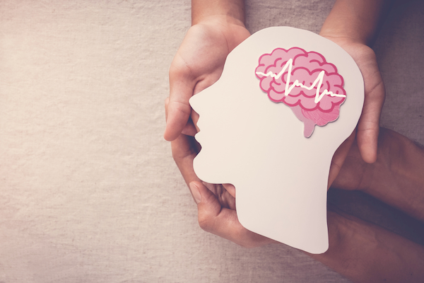 brain health hands hands-holding-paper-silhouette-head-with-brain