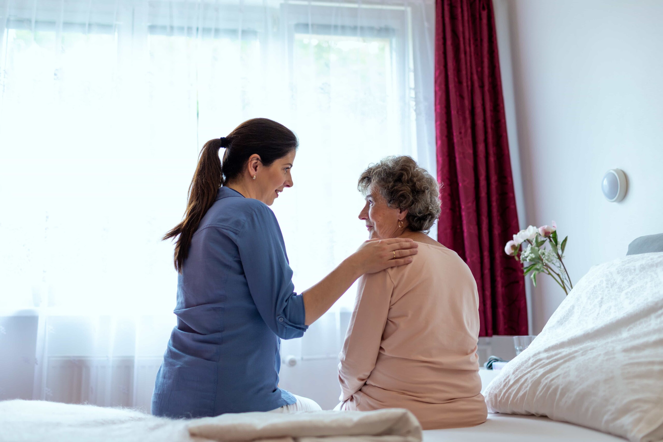 home-caregiver-comforting-senior-woman-patient-sit-2021-08-29-23-02-53-utc (2)